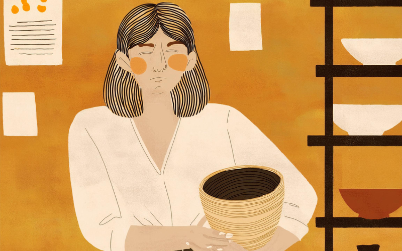 A stylized illustration of a person with shoulder-length, striped dark hair and rosy cheeks, wearing a cream-colored top. They are holding a handcrafted, coiled basket with both hands. The background is a warm ochre tone, with papers pinned on the wall and part of a shelving unit visible on the right side, displaying pottery.
