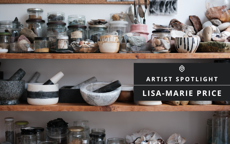 A studio shelf arrangement showing an artist's collection of materials and tools. Multiple glass jars containing various natural materials and pigments line wooden shelves. The middle shelf features several marble or stone mortars and pestles in black, white, and marbled finishes. The composition suggests an organized workspace for art-making or pigment preparation. A black overlay in the image displays "ARTIST SPOTLIGHT" and "LISA-MARIE PRICE" in white text, along with a geometric logo.