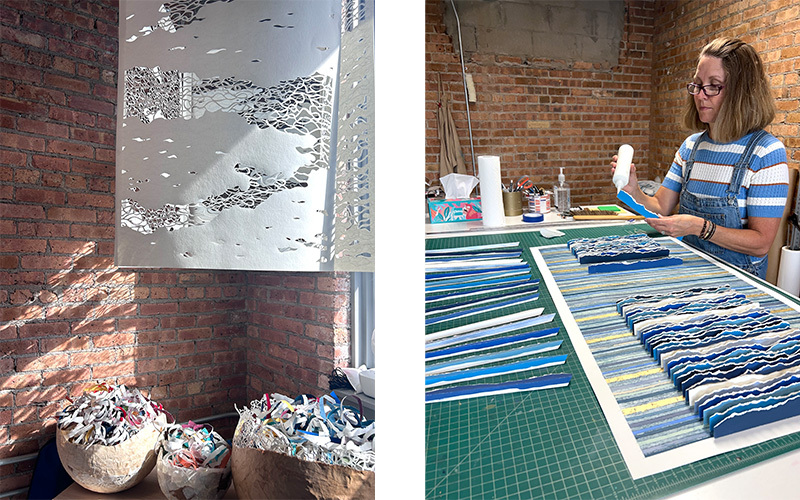 An artist's studio, and an artist working on her artwork