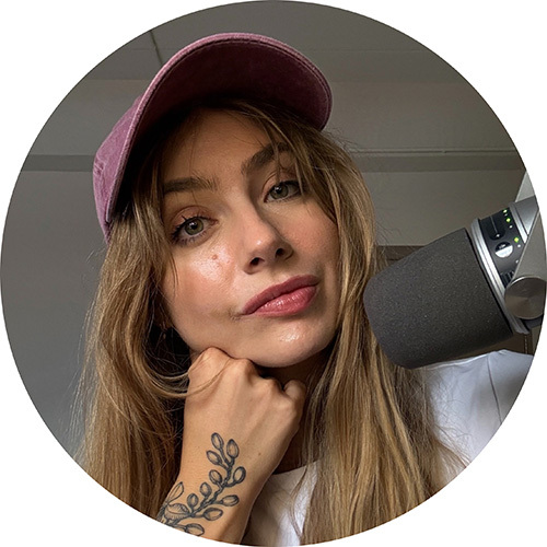 A woman sitting in front of a microphone