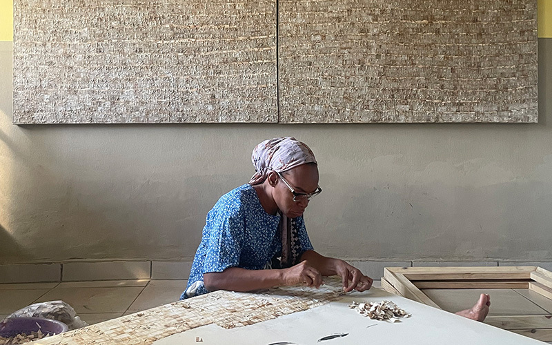 An artist working on a table
